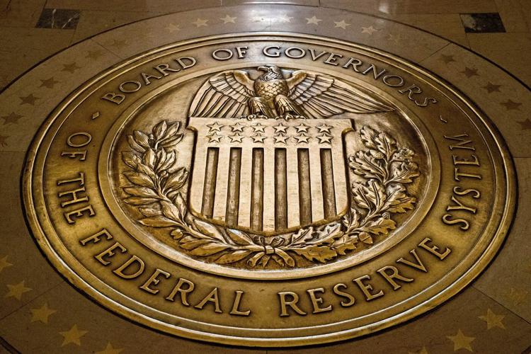 Fed hold rates steady, says job market is 'solid' while inflation 'remains somewhat elevated'