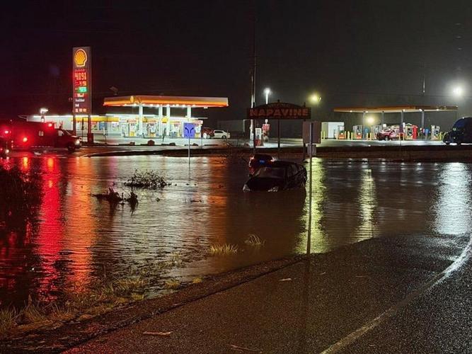 Storms bring heavy rain to the Pacific Northwest, snow and freezing rain to the Upper Midwest