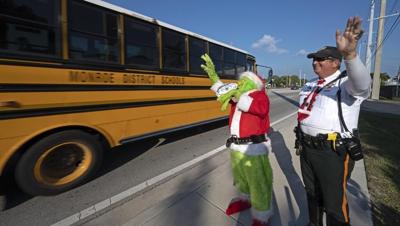 Deputy dressed as Grinch gives onions to speeding drivers