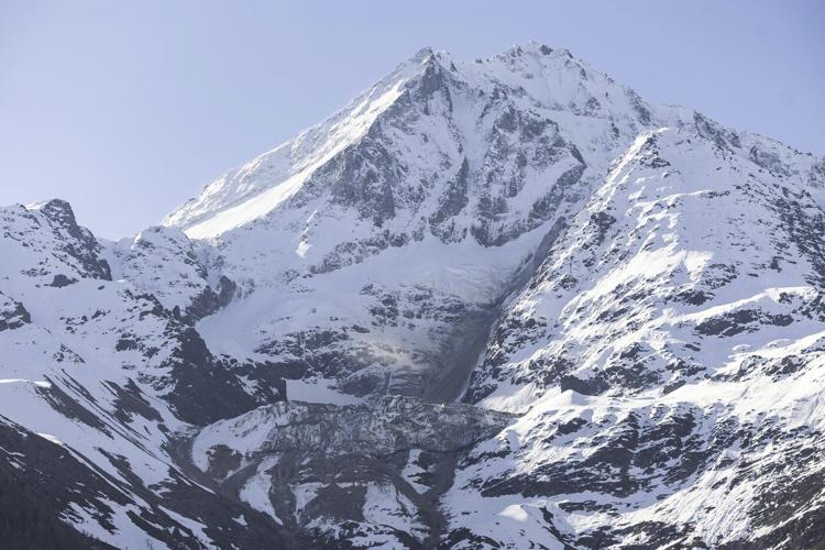 As a landslide threatens an Alpine village, Swiss authorities expand the evacuation order