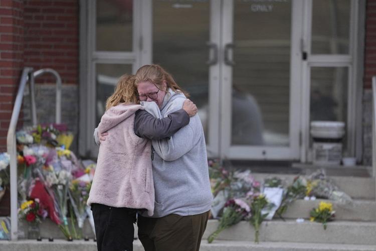 Prosecutor says officer killed in gunman's Pennsylvania hospital siege was hit by police fire