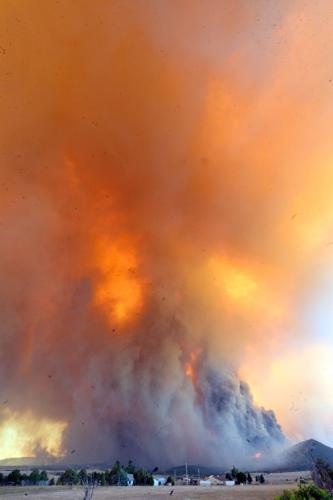 As wildfires worsen, Trump administration revives discredited policy to stomp out all fires quickly