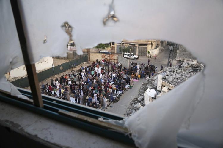 Gaza marks the start of Eid with outdoor prayers amongst the rubble and food growing ever scarcer
