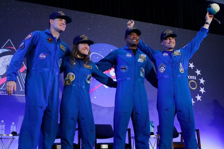 Artemis II's moon-traveling astronauts return home to cheers after a record-breaking trip