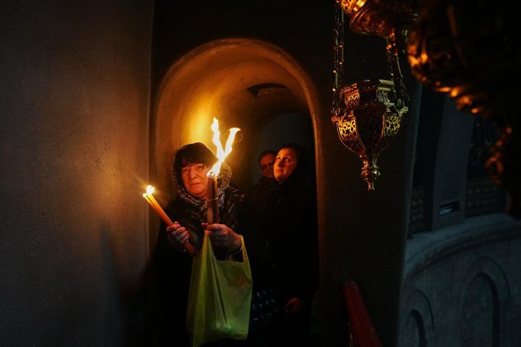 An AP reporter spends the night locked inside Jerusalem's holiest church with clergy and pilgrims