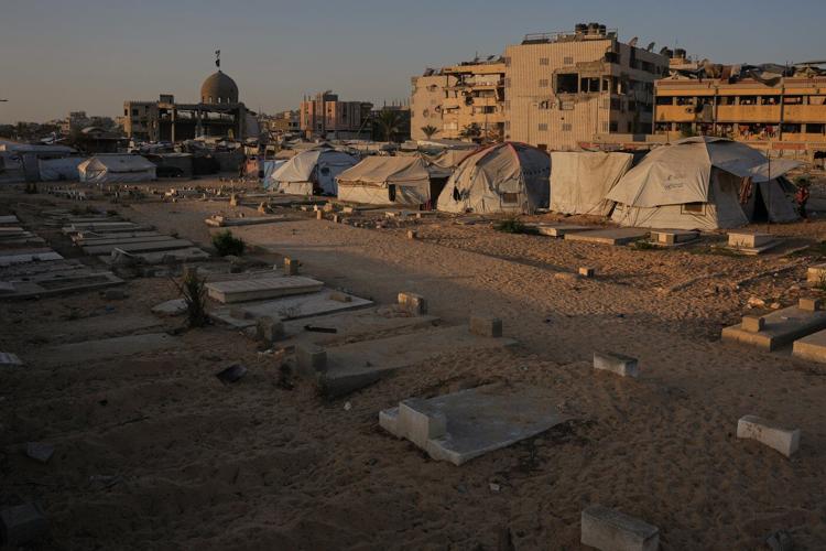 In Gaza cemeteries, some displaced Palestinians live among the dead