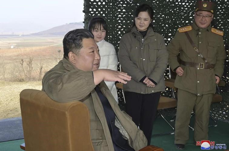 North Korea unveils Kim's daughter at missile launch site