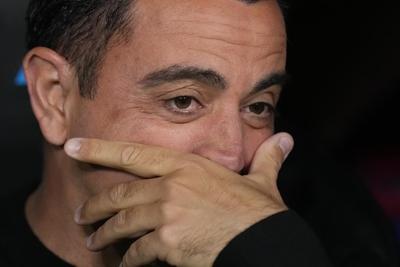 Xavi will stay with Barcelona for another season, AP sources say. Coach had planned to leave