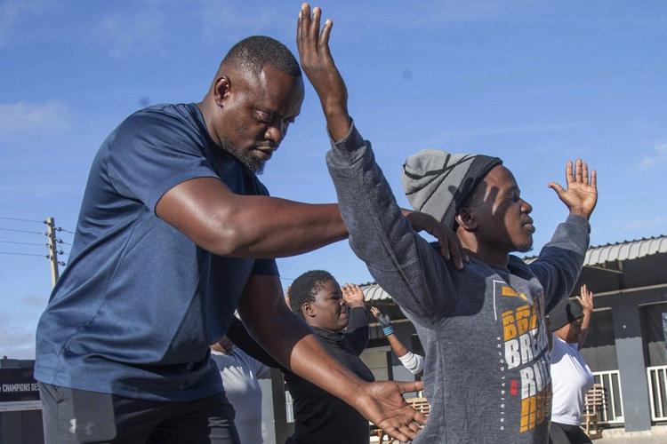 Yoga in a Zimbabwe tavern is the latest mental health outreach in a struggling country
