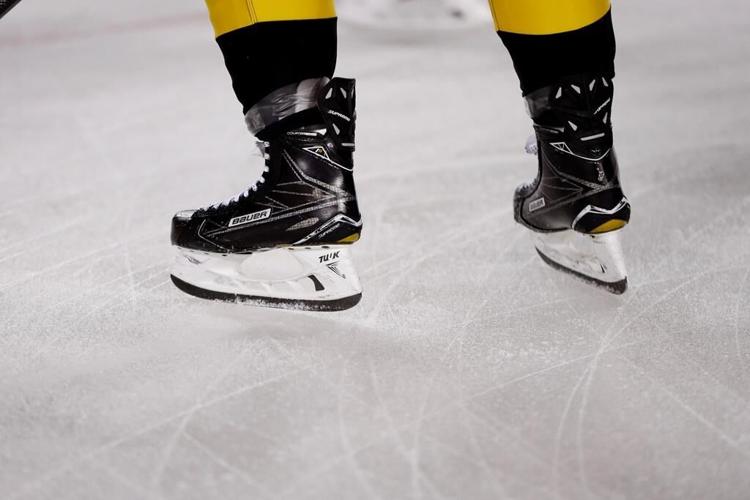 Death of a player from a skate to the neck reignites hockey's stubborn debate over protective gear