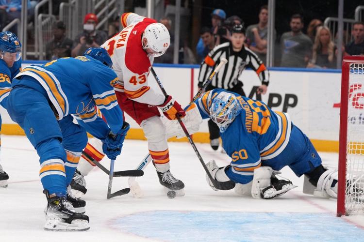 Walker, Binnington lead Blues to 3-2 win over struggling Flames