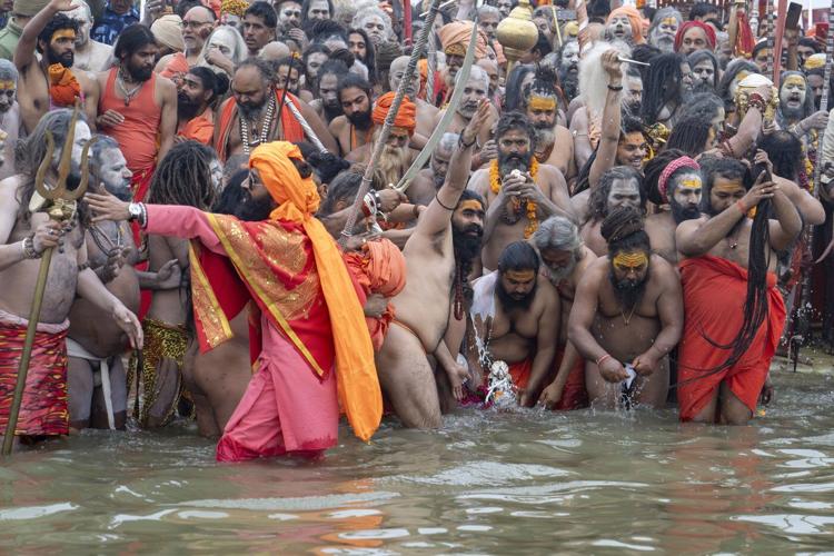 Millions of pilgrims and naked, ash-smeared ascetics take holy dips in India's mega Hindu festival