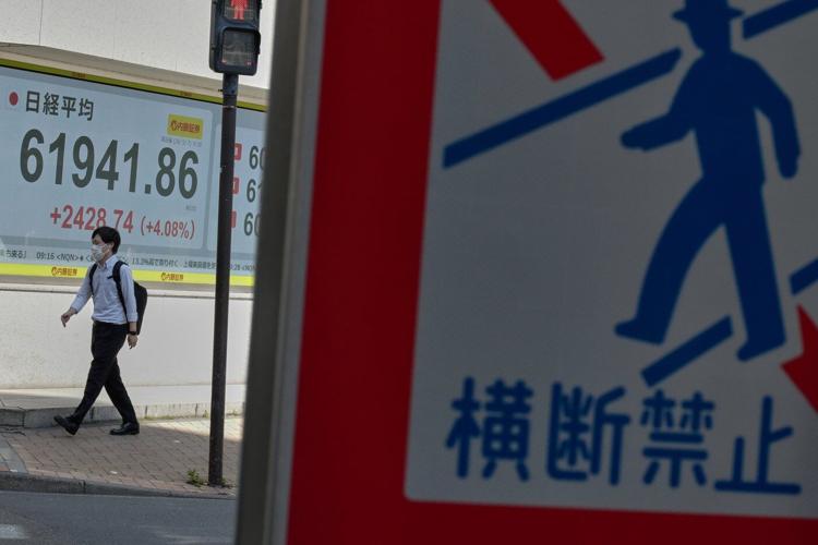 Hopes for reopening the Strait of Hormuz push Asian shares higher, as oil prices hold above $100