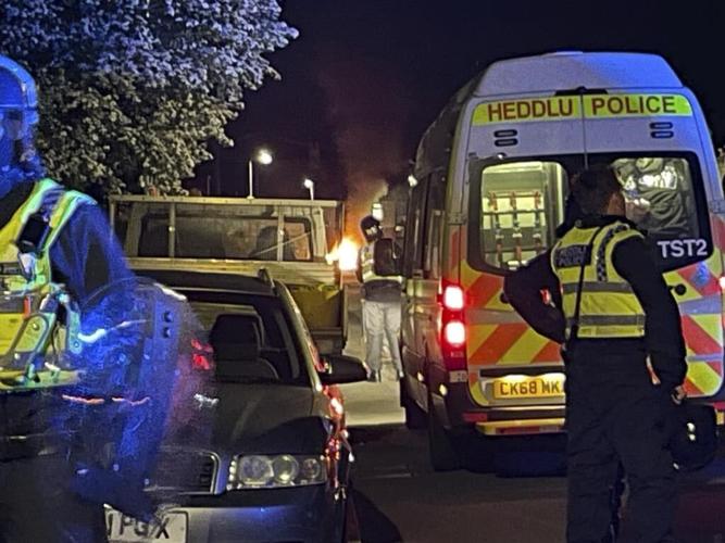 Cars set on fire in Cardiff as UK police face 'large scale disorder' after road crash