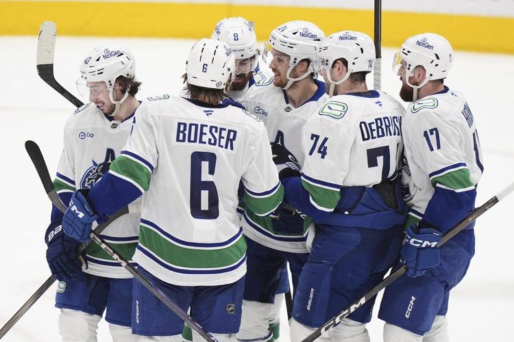 Sherwood's OT goal caps Canucks 3-goal comeback in final minute in 6-5 win over Stars