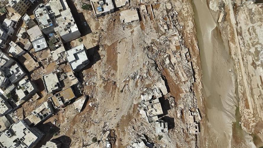 Searchers race to recover bodies in Libyan city where 5,100 died in flooding after 2 dams collapsed