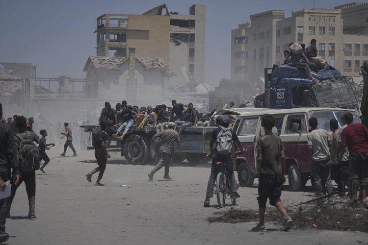 More than 100 aid groups warn of starvation in Gaza as Israeli strikes kill 21, officials say