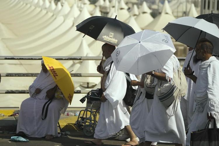 Muslims at Hajj pilgrimage brave intense heat to cast stones at pillars representing the devil