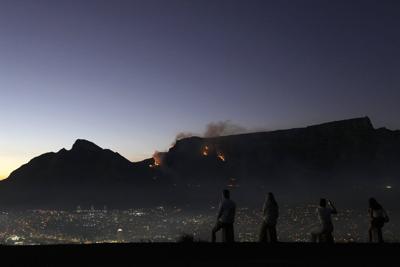 More than 100 firefighters battle blazes on South Africa's Table Mountain in Cape Town