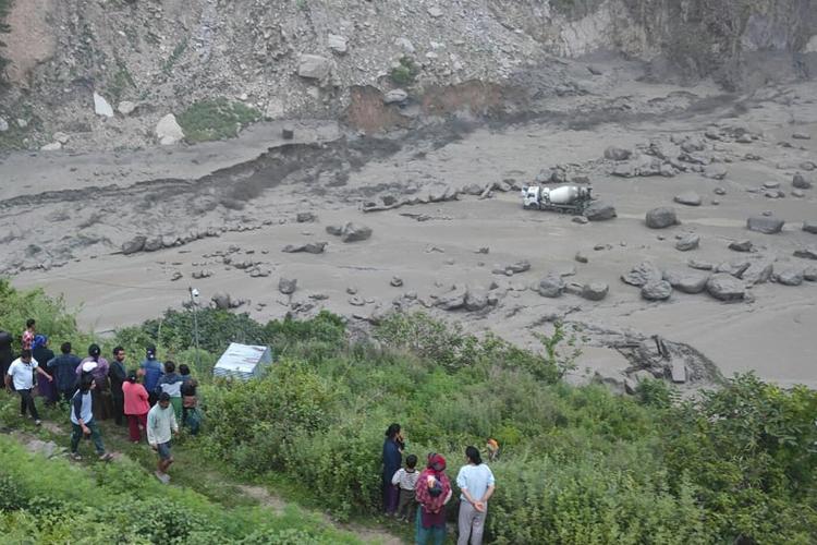 Monsoon floods sweep away 18 people and the main bridge linking Nepal to China