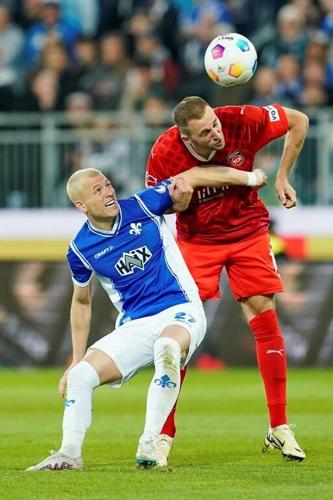 Darmstadt is relegated from the Bundesliga. Late penalty slightly helps Cologne survival hopes