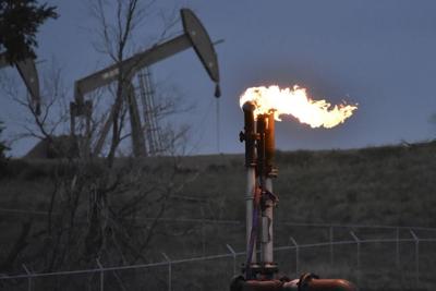 Heat-trapping carbon dioxide and methane levels in the air last year spiked to record highs again