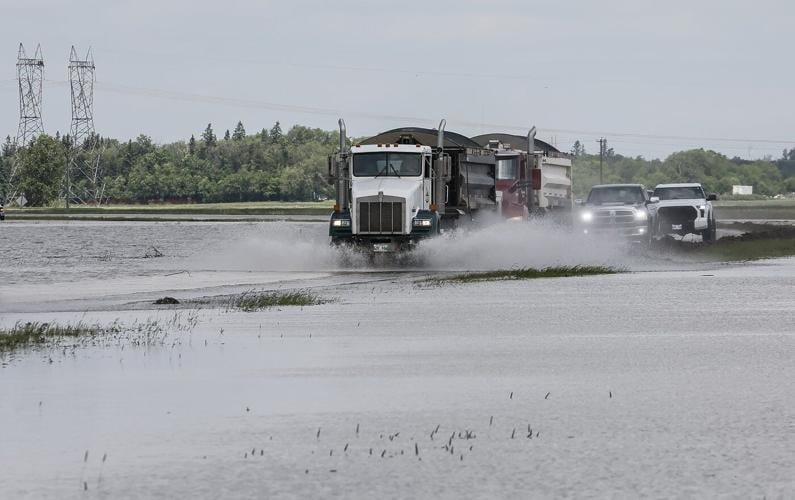 Manitoba premier to tour hard-hit areas as rain closes roads, forces people to flee