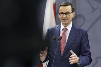 Polish PM defends John Paul II after report he knew of abuse
