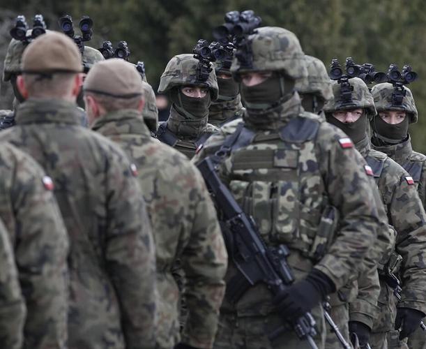 Polish generals named to replace top military commanders who resigned in spat with defense minister