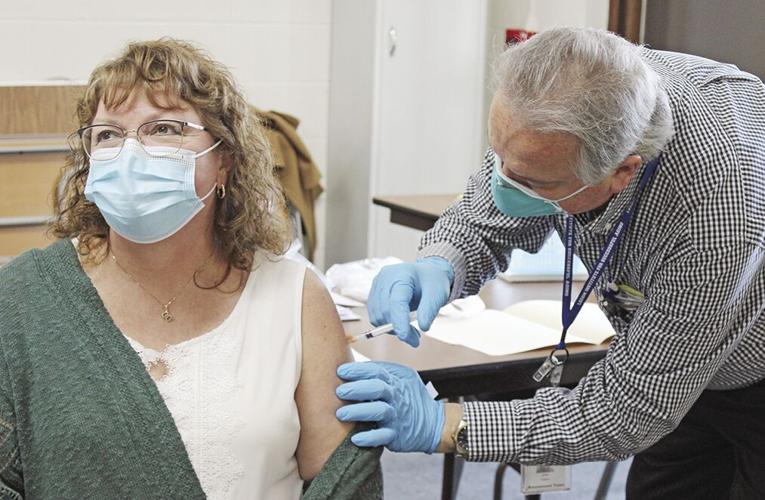 Housing authority tenants, employees receive COVID vaccine News