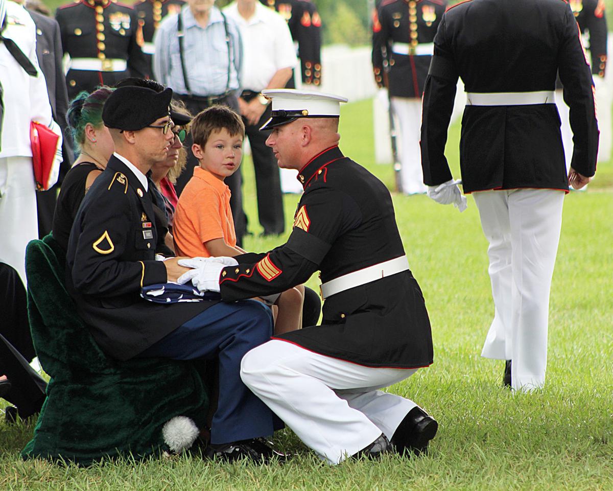 Presenting the flag to son