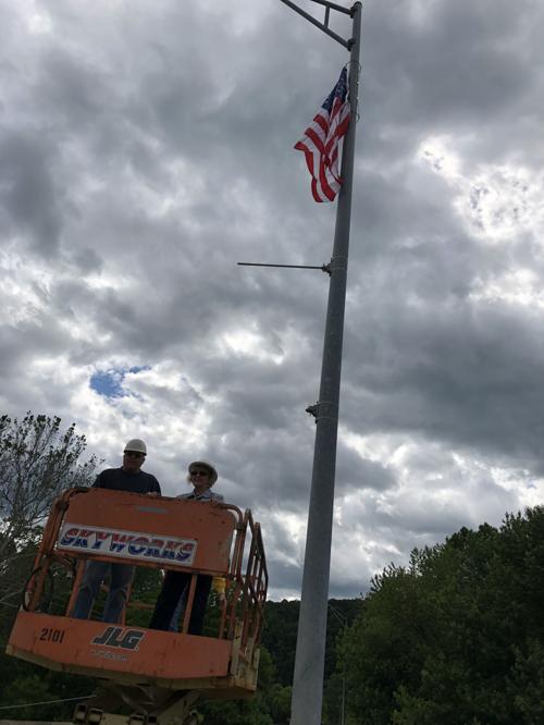Putting the flags up for Flag Day
