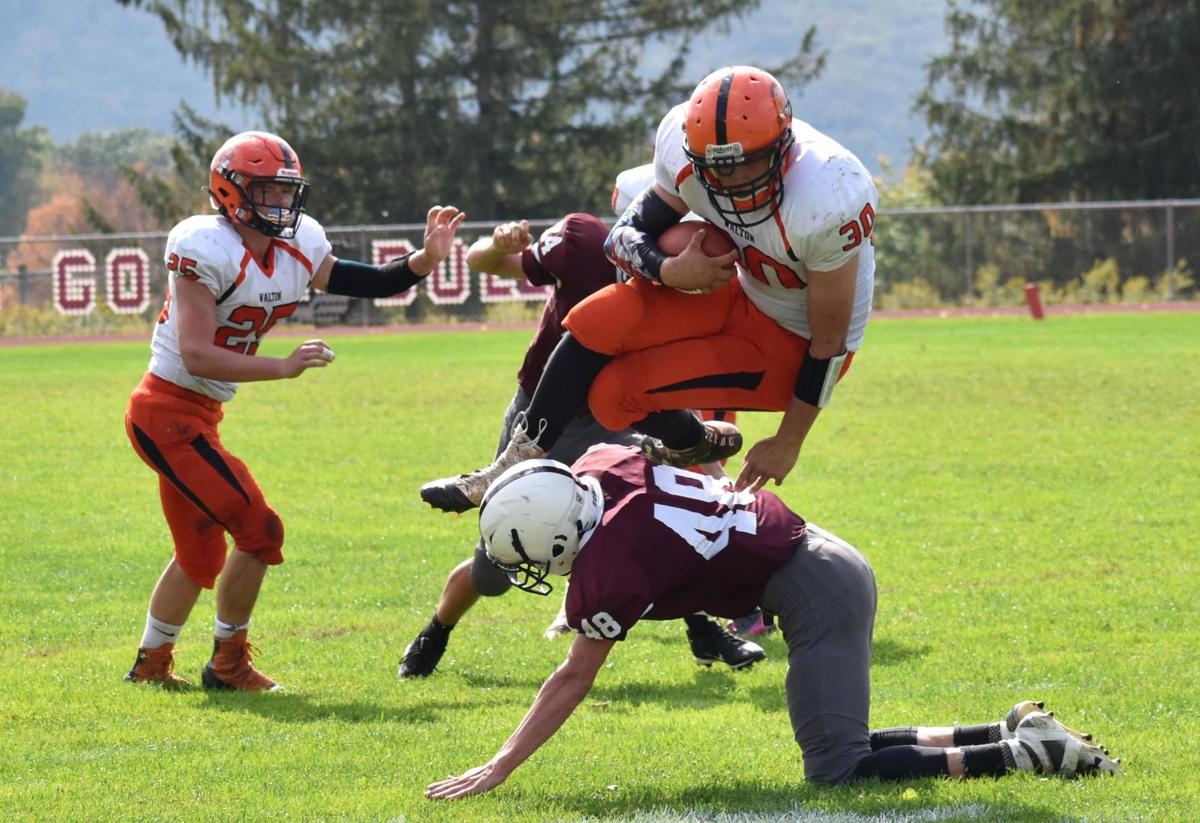 Walton rallies past Delhi, 38-35, in MAC thriller