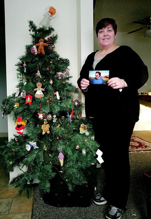 holidays don t bring joy to all local news thedailystar com julie lewis the daily star kate hewlett stands with her downsized christmas tree and holds a photo of her late mother christine macleman in her oneonta
