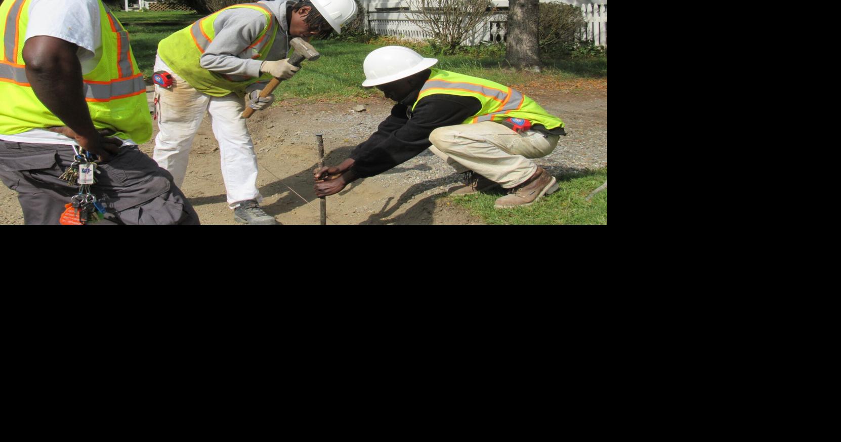 WORKERS FIX A SIDEWALK | Local News | thedailystar.com