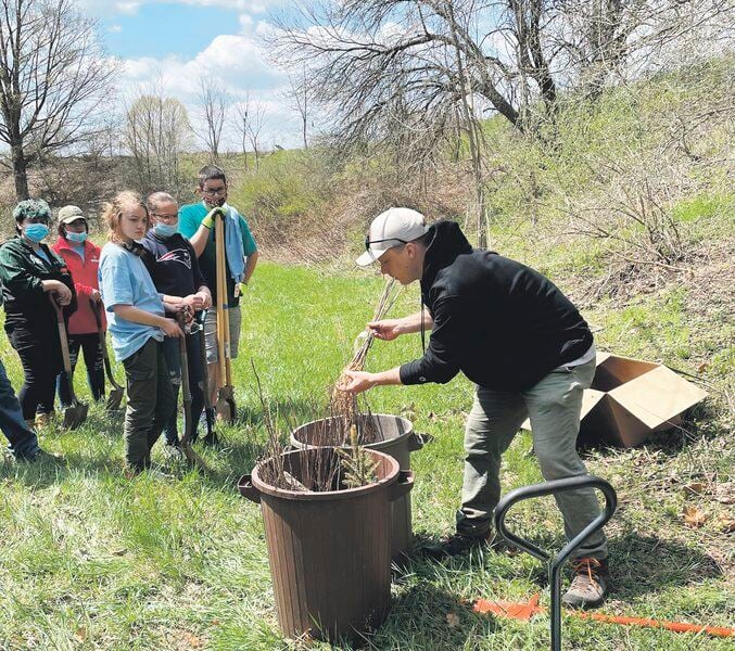Groups plant 150 trees to protect creek