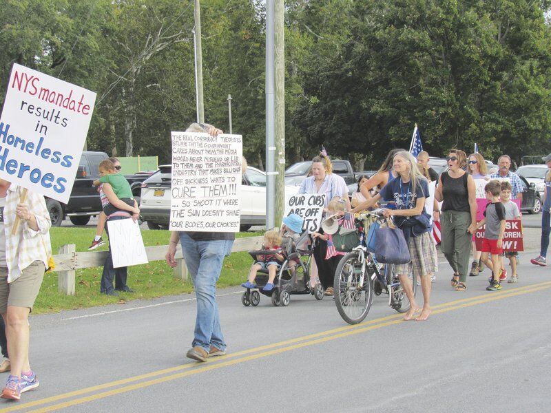 As COVID surges, anti-vaxxers march in Oneonta