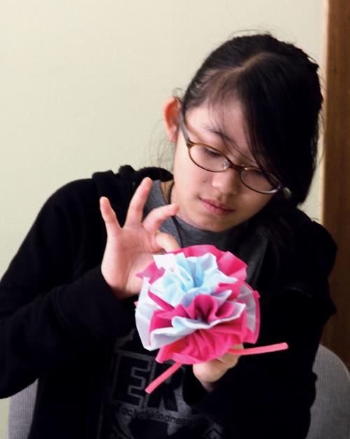 Montgomery Ridge Intermediate School's Kako Tsunashima makes Mother's Day flower for Meals on Wheels