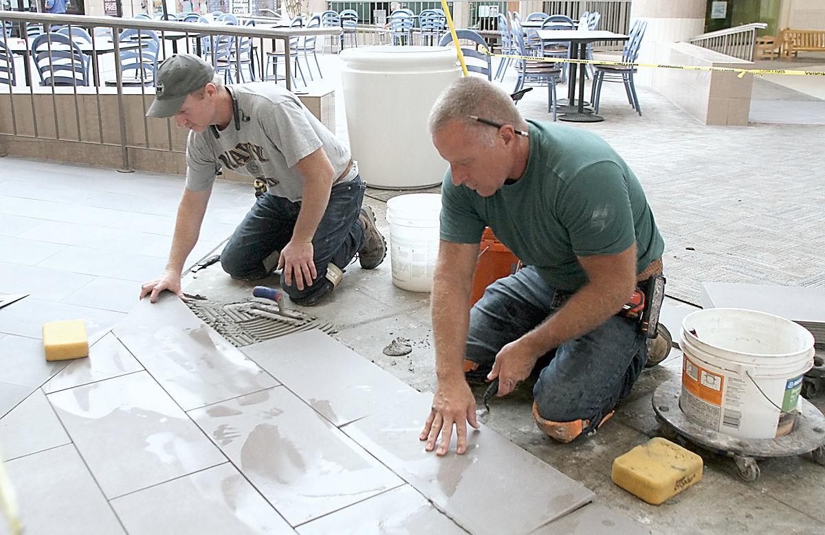 Jodi Whitelaw and Brain Whitelaw put down new flooring