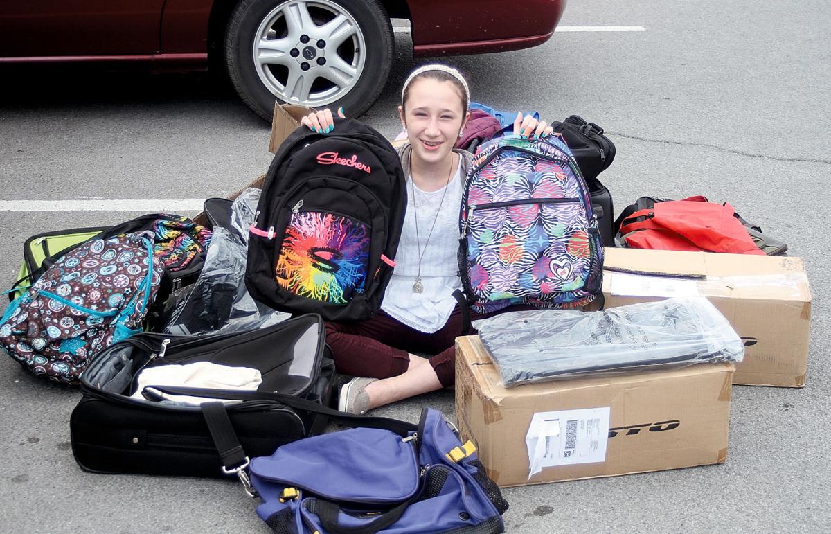 Duffels of Love Foster children receive bags, suitcases Community
