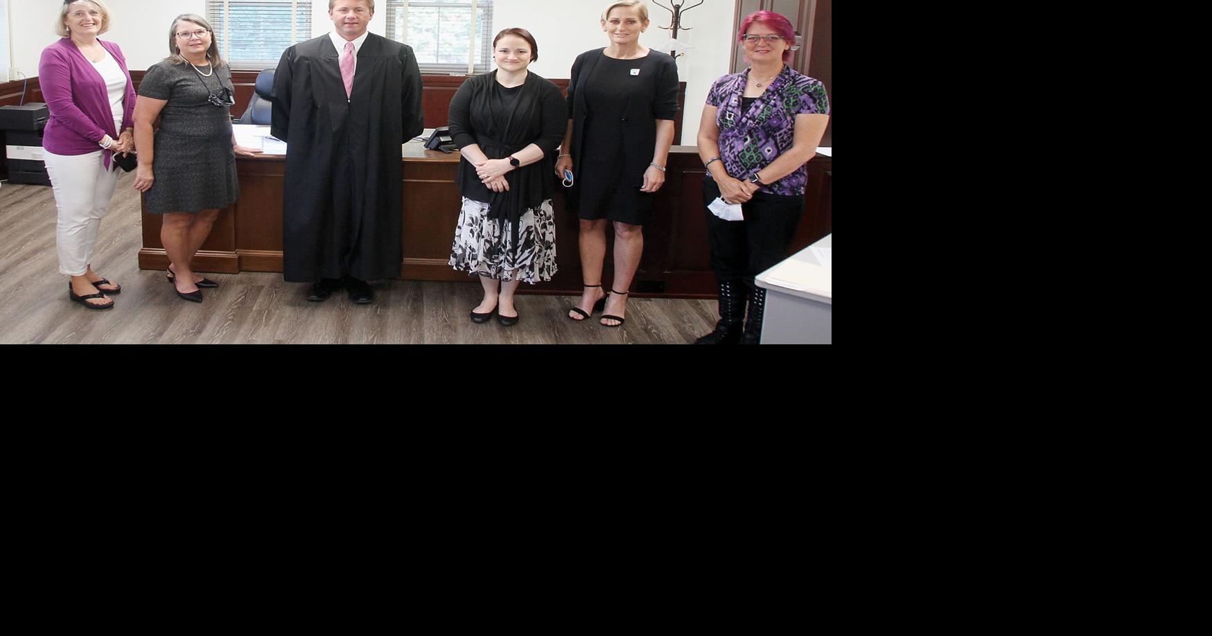 Magistrate Jason Beddingfield swears in volunteers for CASA