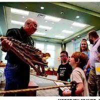 LIBRARY GOERS DIG DINOSAUR GEORGE
