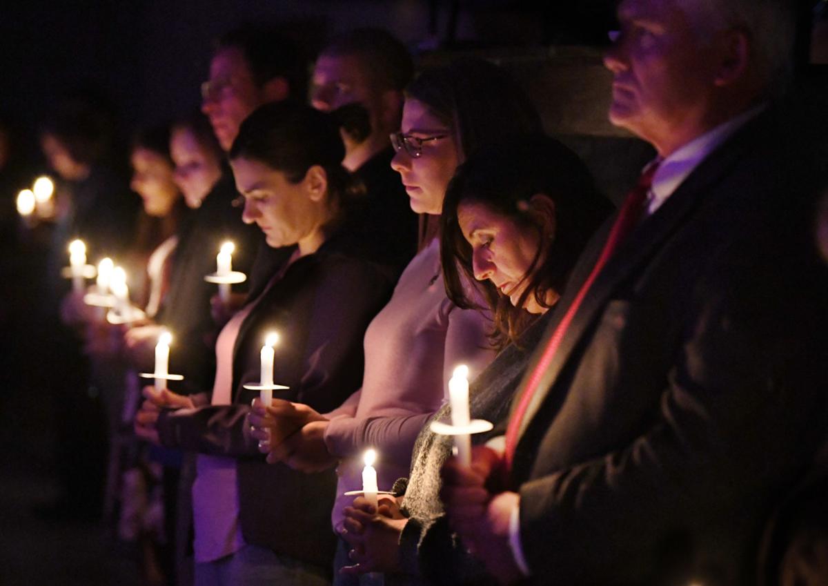 Candlelight vigil honors victims of domestic abuse while raising ...