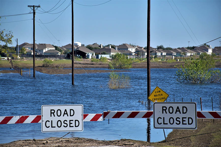 Know the hidden dangers of a flooded roadway