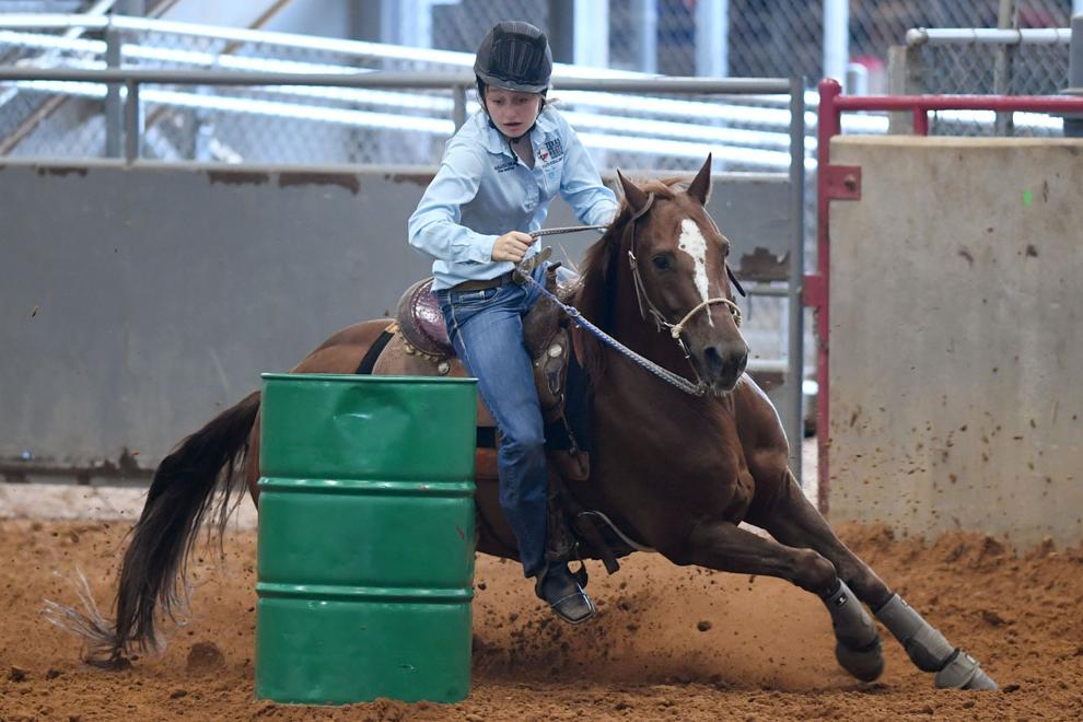 Gallery Barrel racing at the Texas State 4H Horse Show