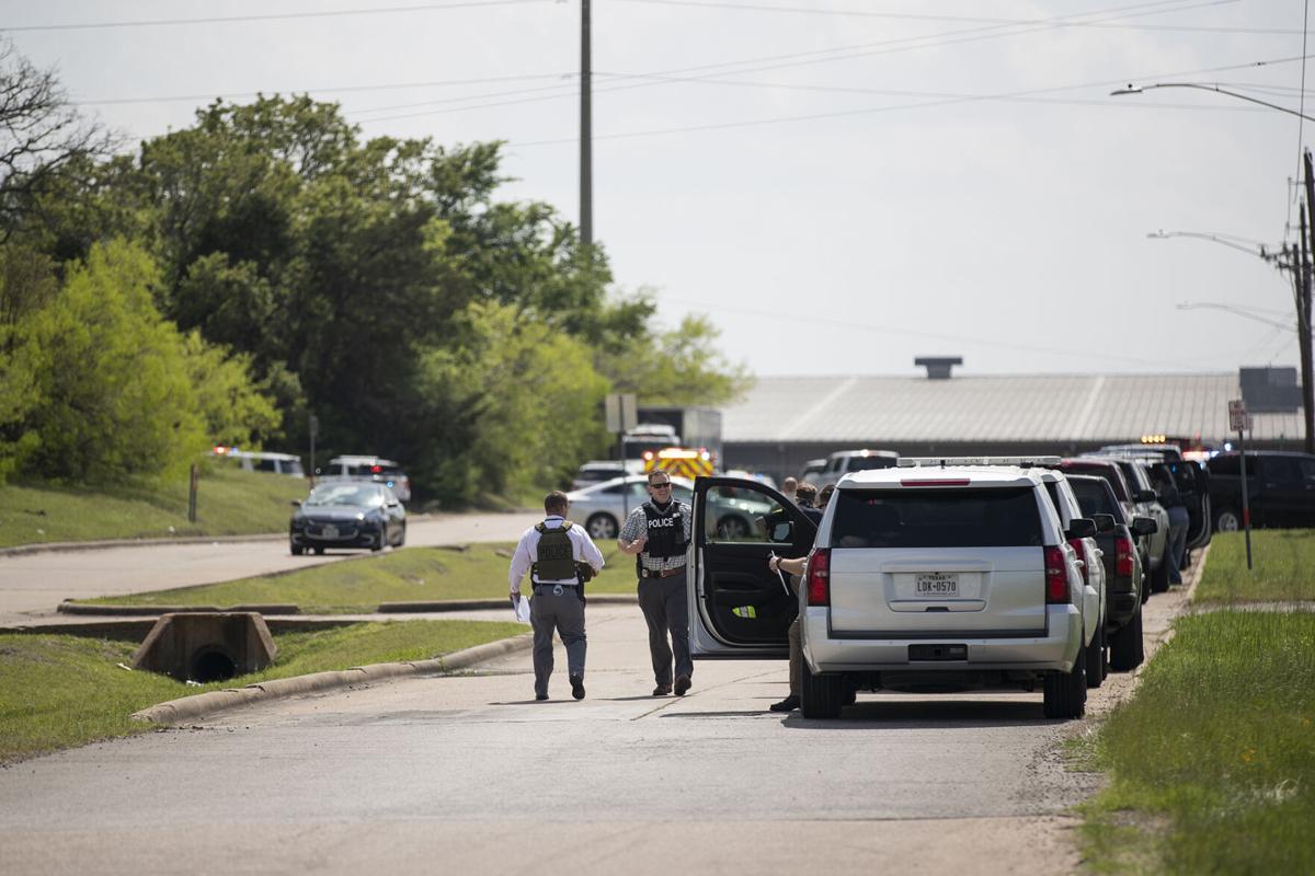 Shooting suspect in custody after one killed at Kent Moore Cabinets