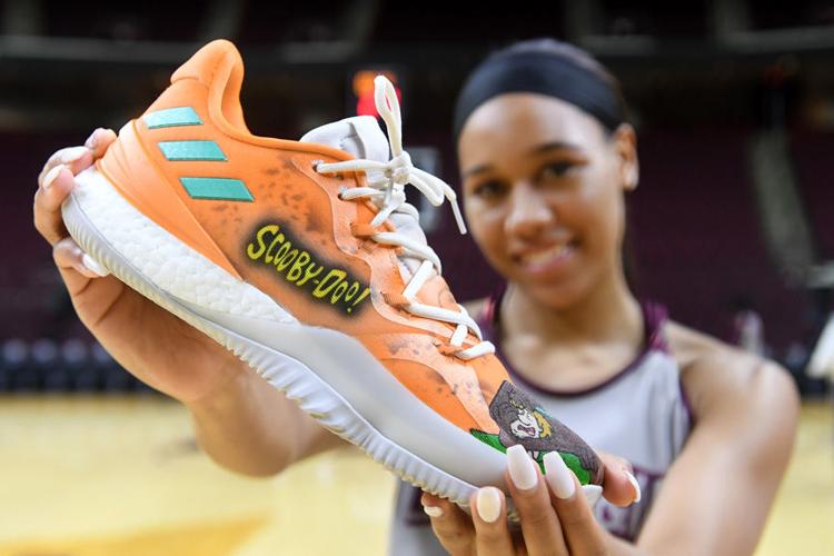 Custom sneakers pay tribute to Aggie women's favorite childhood cartoons