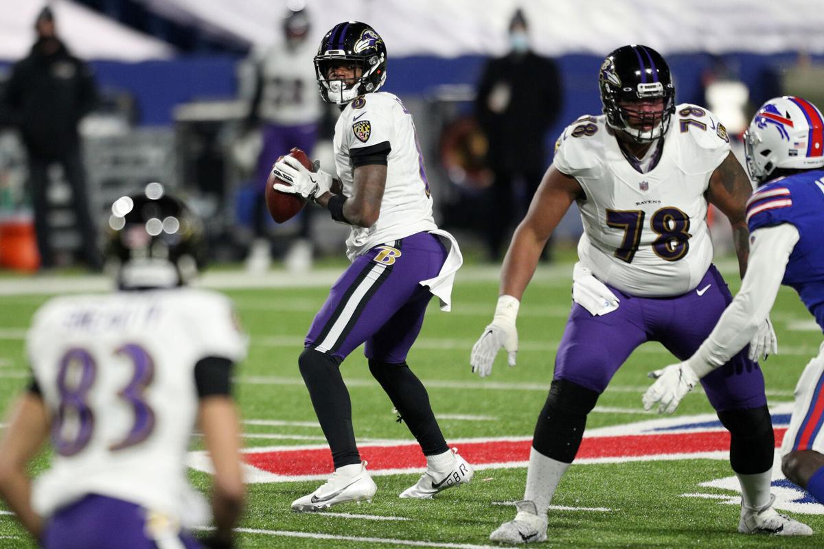 Lamar Jackson of the Baltimore Ravens looks to pass in the third quarter against the Buffalo Bills during the AFC Divisional Playoff game on Saturday, Jan. 16, 2021 at Bills Stadium in Orchard Park, New York.
