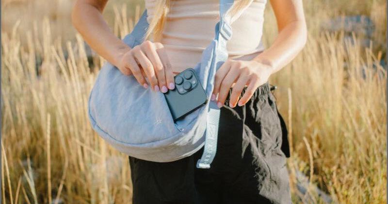 Model wearing Thread® Crescent Bag in Sky Blue