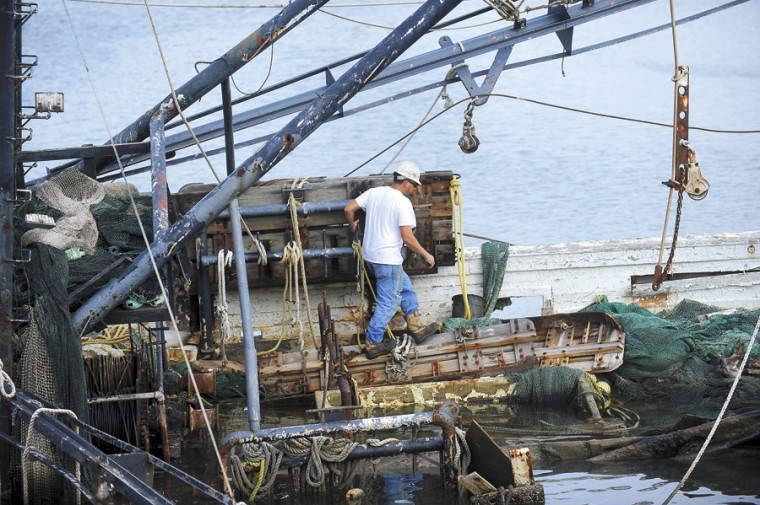 Abandoned shrimp boats being removed from Old Brazos River | News ...